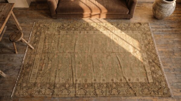 Faded antique east turkestan wool pile hand knotted khotan rug 2 Faded antique east turkestan wool pile hand knotted khotan rug (sku 19650) - styled overhead view