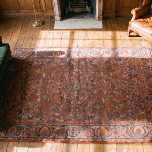 Finely Woven Small Antique Floral Medallion Pattern Persian Kashan Rug (SKU 20214) - styled overhead view