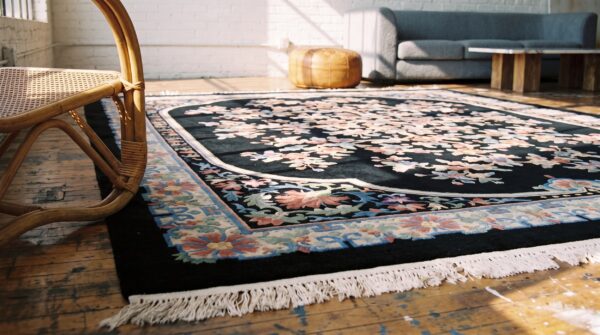 Antique floral medallion wool hand knotted pile black 1920s rug 13 Antique floral medallion wool hand knotted pile black 1920s rug (sku 22342) - in-room detail