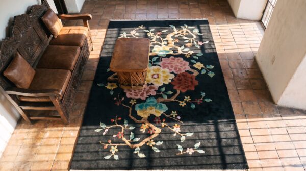 Floral medallion black wool 1920s antique hand knotted pile rectangle rug 2 Floral medallion black wool 1920s antique hand knotted pile rectangle rug (sku 25533) - styled overhead view