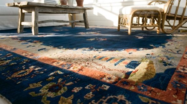 Floral medallion blue antique 1920s large wool rectangle hand knotted pile rug (sku 25594) - in-room detail