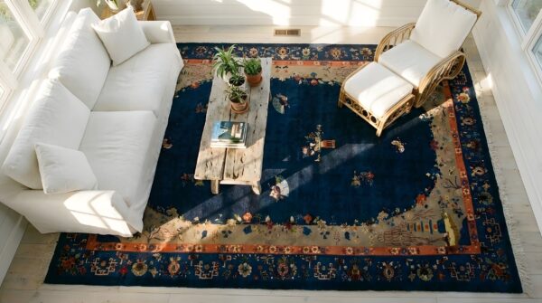 Floral medallion blue antique 1920s large wool rectangle hand knotted pile rug (sku 25594) - styled overhead view