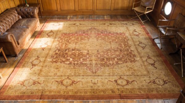 Antique floral medallion square wool hand knotted pile coral / salmon pink 1900s rug 2 Antique floral medallion square wool hand knotted pile coral / salmon pink 1900s rug (sku 20292) - styled overhead view