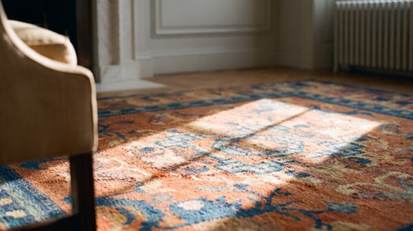 Antique hand knotted floral medallion wool square yellow 1900s rug (sku 23372) - in-room detail