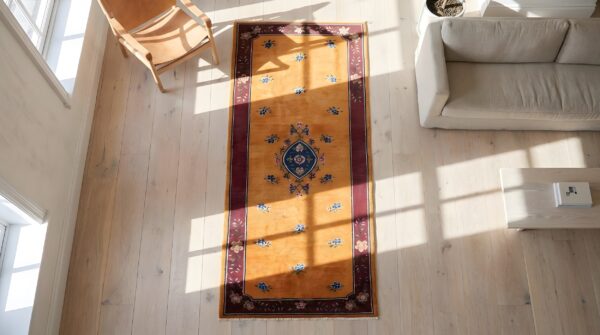 Antique floral medallion wool hand knotted yellow 1920s hallway runner rug 2 Antique floral medallion wool hand knotted yellow 1920s hallway runner rug (sku 22294) - styled overhead view