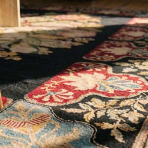 Antique French Needlepoint Carpet 5'2"×8'8" Black with Roses, Raspberry Border, Circa 1890 (SKU 19052) - in-room detail