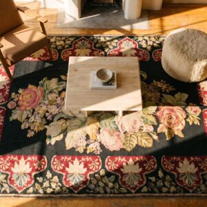 Antique French Needlepoint Carpet 5'2"×8'8" Black with Roses, Raspberry Border, Circa 1890 (SKU 19052) - styled overhead view