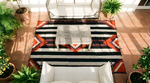 Geometric flatwoven antique native american chiefs blanket rug (sku 25322) - styled overhead view