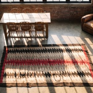 Antique Geometric Jagged Stipes Native American Flat Weave Ivory Navajo Tribal Rug (SKU 20896) - styled overhead view
