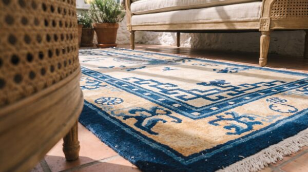 Antique geometric medallion wool hand knotted pile ivory beige cream white 1880s rug 8 Antique geometric medallion wool hand knotted pile ivory beige cream white 1880s rug (sku 21978) - in-room detail