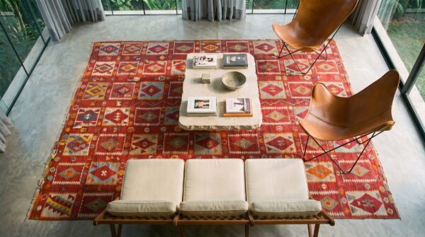 Graphic tribal geometric antique coral turkish kilim flatweave rug 2 Graphic tribal geometric antique coral turkish kilim flatweave rug (sku 23291) - styled overhead view