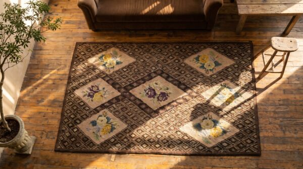 Gray geometric diamond design with ivory floral inlay sections antique american folk art hooked rug 2 Gray geometric diamond design with ivory floral inlay sections antique american folk art hooked rug (sku 19247) - styled overhead view