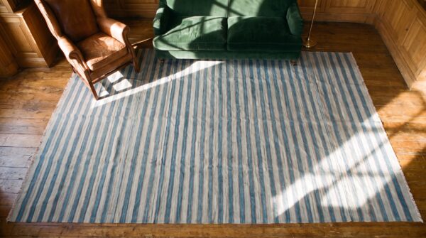 Antique indian allover geometric blue and white stripes flatweave cotton dhurrie rug 2 Antique indian allover geometric blue and white stripes flatweave cotton dhurrie rug (sku 21335) - styled overhead view