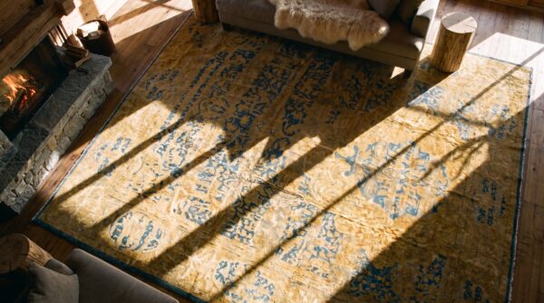 Antique indian lahore carpet 14'×23' blue medallion, soft yellow border, circa 1920 (sku 19302) - in-room detail