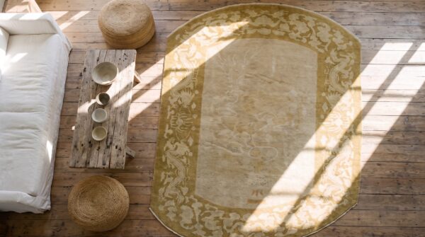 Ivory antique chinese crane and dragon design oval peking rug 2 Ivory antique chinese crane and dragon design oval peking rug (sku 21364) - styled overhead view