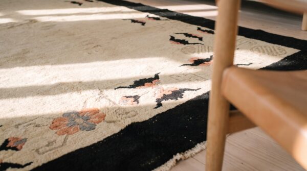 Antique ivory color open field chinese bats border peking rug 8 Antique ivory color open field chinese bats border peking rug (sku 20346) - in-room detail