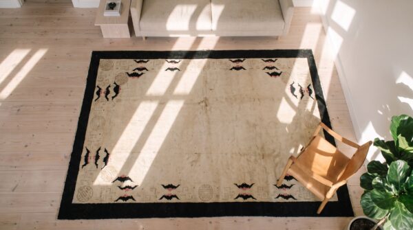 Antique ivory color open field chinese bats border peking rug 2 Antique ivory color open field chinese bats border peking rug (sku 20346) - styled overhead view