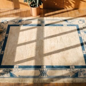 Ivory Minimalist Solid Open Field Antique Chinese Dragon Peking Rug (SKU 22808) - styled overhead view