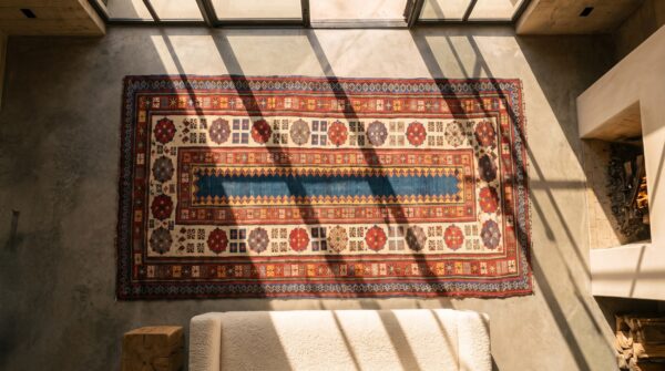 Antique kazak caucasian knotted rug 2 Antique kazak caucasian knotted rug (sku 18341) - styled overhead view