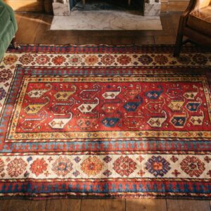 Antique Kazak Small Scatter Size Wool Coral Rug (SKU 18598) - styled overhead view