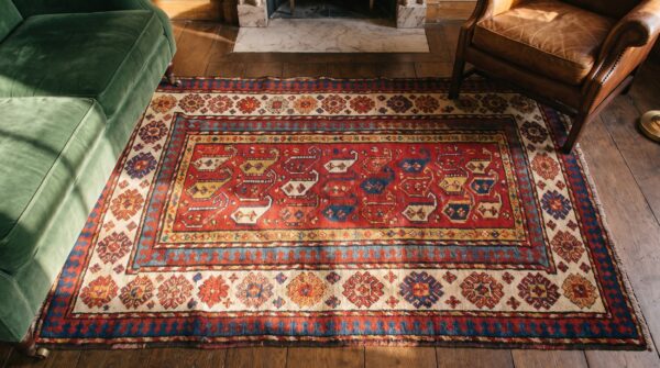Antique kazak small scatter size wool coral rug 2 Antique kazak small scatter size wool coral rug (sku 18598) - styled overhead view