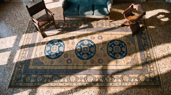 Antique khotan carpet 6'3"×13'5" plum & yellow medallion, circa 1870, east turkestan 2 Antique khotan carpet 6'3"×13'5" plum & yellow medallion, circa 1870, east turkestan (sku 19023) - styled overhead view