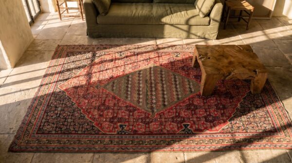 Antique kilim - senneh small scatter size wool multicolor rug (sku 21430) - styled overhead view