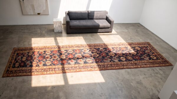 Antique kurdish hallway runner wool blue allover rug (sku 21098) - styled overhead view