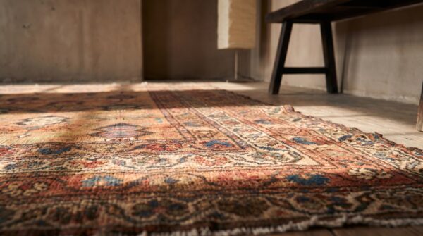 Antique kurdish small scatter size wool coral rug 5 Antique kurdish small scatter size wool coral rug (sku 18133) - in-room detail