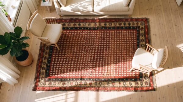 Antique kurdish small scatter size wool yellow rug 2 Antique kurdish small scatter size wool yellow rug (sku 23666) - styled overhead view