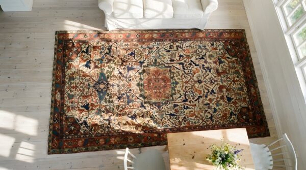 Antique large caucasian medallion knotted rug 2 Antique large caucasian medallion knotted rug (sku 23781) - styled overhead view