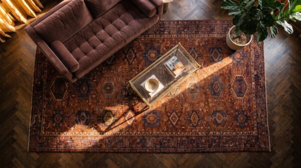 Antique large coral karajeh persian allover geometric knotted rug 2 Antique large coral karajeh persian allover geometric knotted rug (sku 24099) - styled overhead view