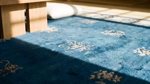 Antique large peking chinese medallion knotted rug (sku 23748) - in-room detail