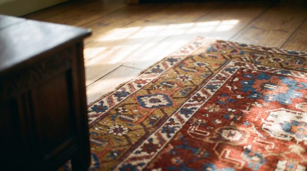 Large red tribal geometric antique persian heriz serapi room size rug 15 Large red tribal geometric antique persian heriz serapi room size rug (sku 24078) - in-room detail
