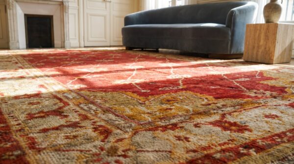 Large scale arts and crafts design antique red turkish oushak rug (sku 18467) - in-room detail