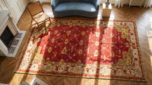 Large scale arts and crafts design antique red turkish oushak rug (sku 18467) - styled overhead view