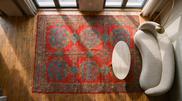 Antique large scale tribal arts and crafts design red turkish oushak very long wool hallway runner rug (sku 21290) - styled overhead view