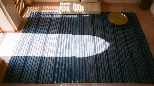 Large size blue color stripe pattern antique flat weave cotton dhurrie rug 2 Large size blue color stripe pattern antique flat weave cotton dhurrie rug (sku 24149) - styled overhead view