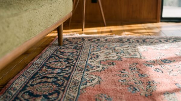 Antique large size coral floral persian khorassan knotted rug 6 Antique large size coral floral persian khorassan knotted rug (sku 20093) - in-room detail