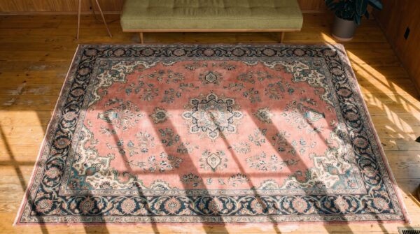 Antique large size coral floral persian khorassan knotted rug 2 Antique large size coral floral persian khorassan knotted rug (sku 20093) - styled overhead view