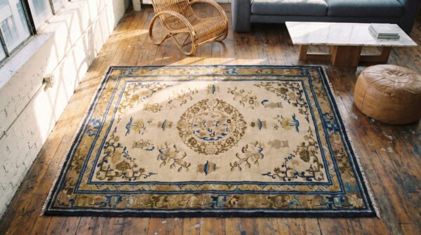 Late 19th century ivory antique chinese central floral medallion ningxia rug 2 Late 19th century ivory antique chinese central floral medallion ningxia rug (sku 19004) - styled overhead view