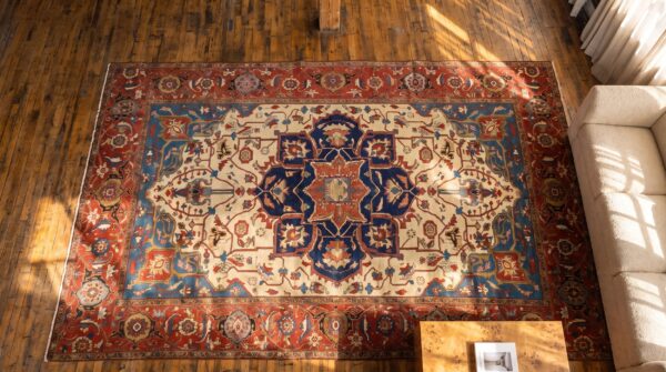 Late 19th century ivory antique persian serapi heriz tribal geometric room size rug (sku 21217) - styled overhead view