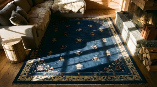 Antique late 19th century navy blue chinese floral peking rug (sku 23497) - styled overhead view