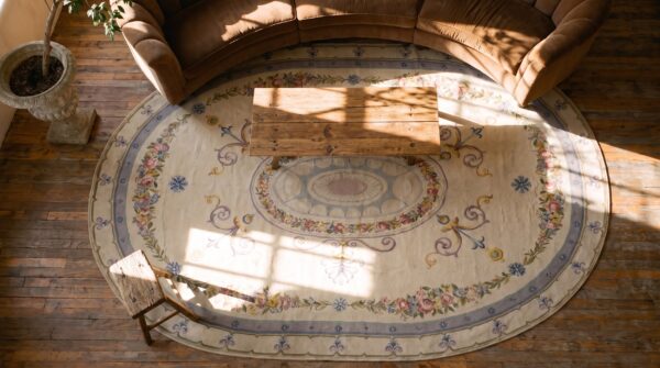 Antique late 19th century oval french aubusson room size carpet (sku 25552) - styled overhead view