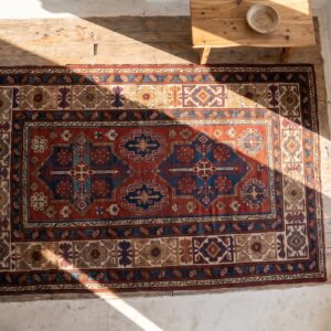 Late 19th Century Tribal Antique Bold Red Caucasian Kuba Rug (SKU 17956) - styled overhead view