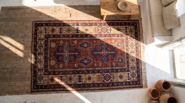 Late 19th century tribal antique bold red caucasian kuba rug 2 Late 19th century tribal antique bold red caucasian kuba rug (sku 17956) - styled overhead view