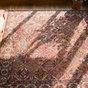 Antique Late 19th Century Tribal Geometric Diamond Garden Design Oversized Persian Bakhtiari Rug (SKU 20248) - styled overhead view