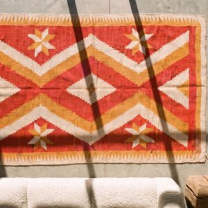 Light Coral Antique Native American Flatweave Tribal Geometric Small Navajo Rug (SKU 20582) - styled overhead view