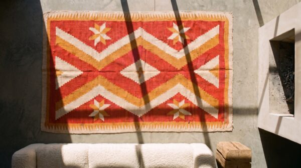 Light coral antique native american flatweave tribal geometric small navajo rug 2 Light coral antique native american flatweave tribal geometric small navajo rug (sku 20582) - styled overhead view