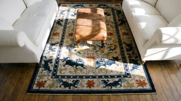 Light ivory color antique silk pile chinese foo dog design area rug (sku 24758) - styled overhead view